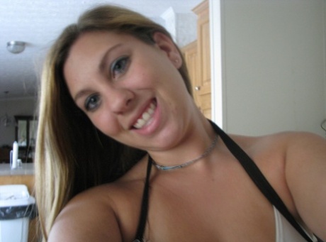 Taking pictures of her intimate figure, Nikki Morgan is an unrefined amateur photographer who shows off her cleavage.