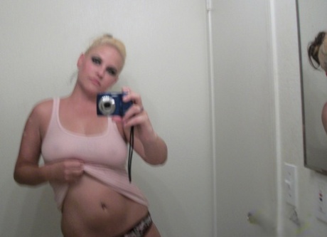 When someone is a lavish blonde, she often takes selfies of herself with her big boobs and asses in the mirror.