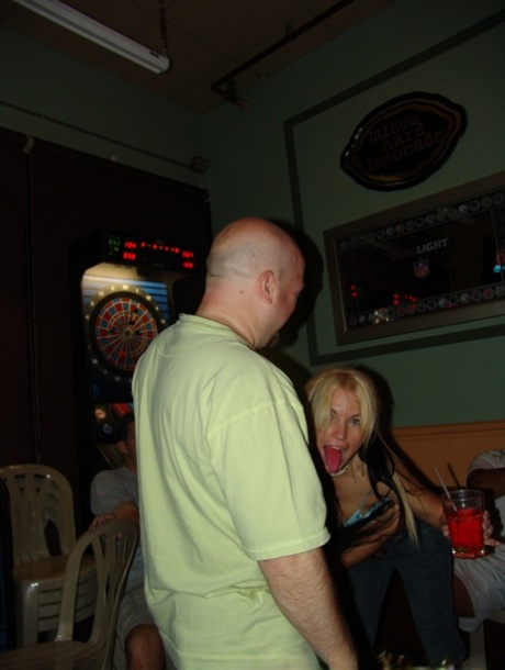 Sleek wives exhibit their ample breasts in a frenzied display at the bar.