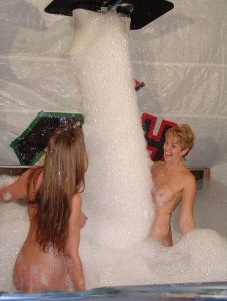 Featuring a short-haired girl, Tracy and pornstar Jessie James are seen sharing their double-sided dildo.