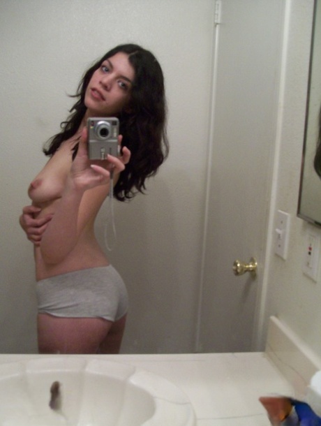 Dark haired teen takes selfies of her nice ass & natural tits in the mirror