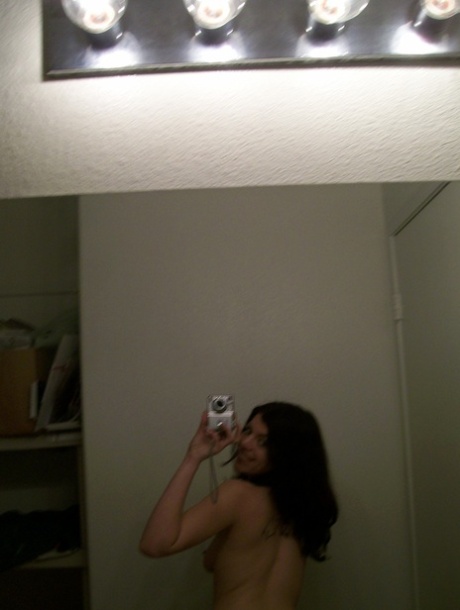 Dark haired teen takes selfies of her nice ass & natural tits in the mirror