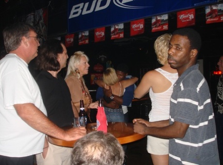 During a wild bar crawl, amateur swingers flaunt her massive breasts.