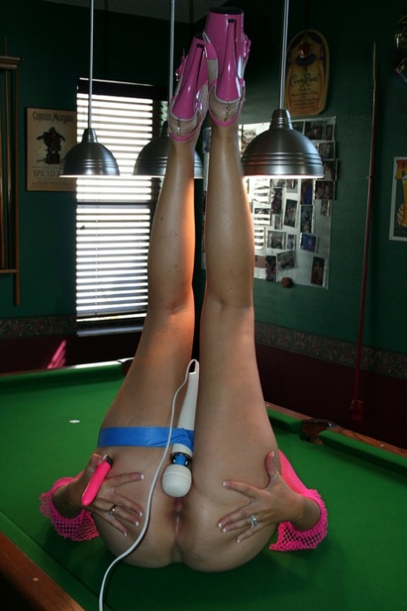 The sexy Tracy Lick, who is an amateur MILF, passionately pleasuring herself on the pool table.