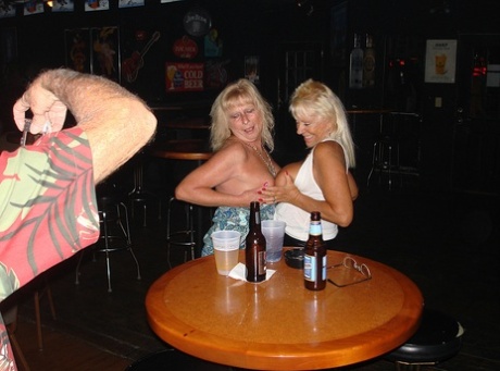 Women of swinger style, with big boobs on each side, can be rude at the party.