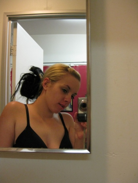 Shameless teen Donna takes selfies of her big tits with pierced nipples