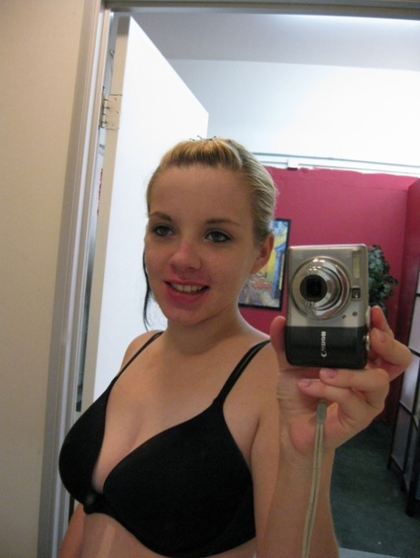 Shameless teen Donna takes selfies of her big tits with pierced nipples