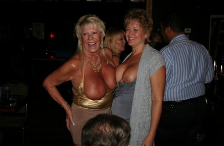 Big-bodied blonde MILFs with curvaceous bellies share black cock at party.