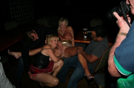 Long, curvy blonde MILFs with large tits partying and sharing black heads.