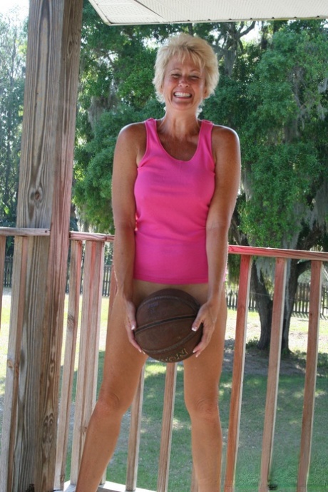 Traces: Mature Tracy Lick shows off her nice tits as she plays with the basketball in the nude.