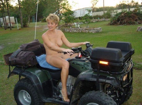 Amateur Swinger With Fake Tits Tracy Lick Poses Naked On A Fourwheeler