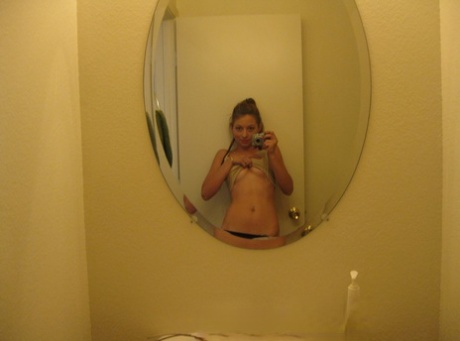 Beautiful amateur teen Dixie takes selfies of her hot body in the mirror