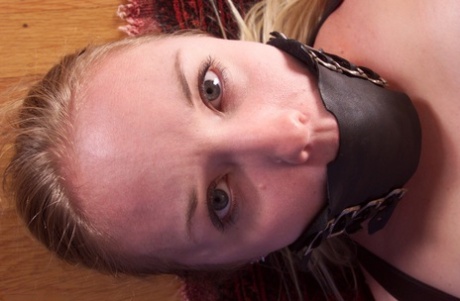A deliciously edible pussy is exposed during the flogging of blonde Kaylee, who gets bound up with it.