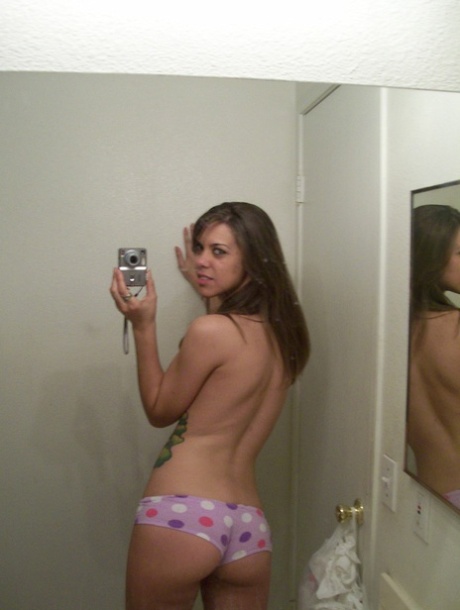 Amateur teen shows her petite body in panties while taking nude photos