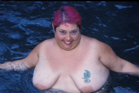 BBW Cadence Harden is an attractive person who can be seen stripping and posing with her buttocks in a nude moment by the pool.