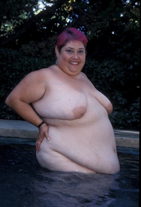 BBW Cadence Harden, a captivating character, is captured stripping and taking a naked selfie by the pool.