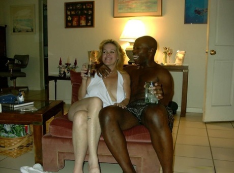 An unisexual woman displays her prominent buttocks while engaging in a game with a black man.