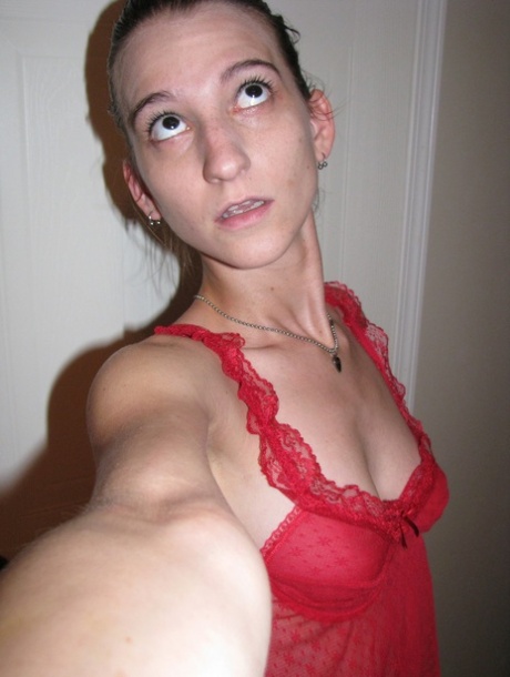 Adolescent amateur Brandi Montes models herself in her red lingerie and & strips for a cute photo opportunity.