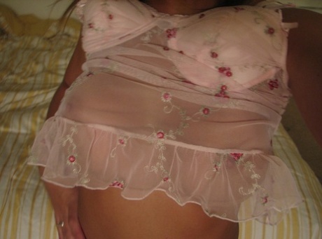 A strapless little girl exhibits her ample buttock muscles while donning alluring lingerie.