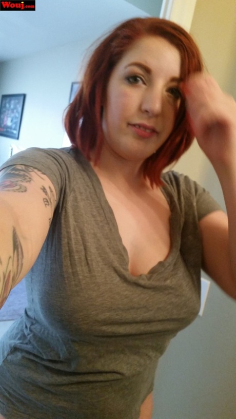 Fat and chubby redhead WouJ taking selfies while being mocked with her juicy tits.