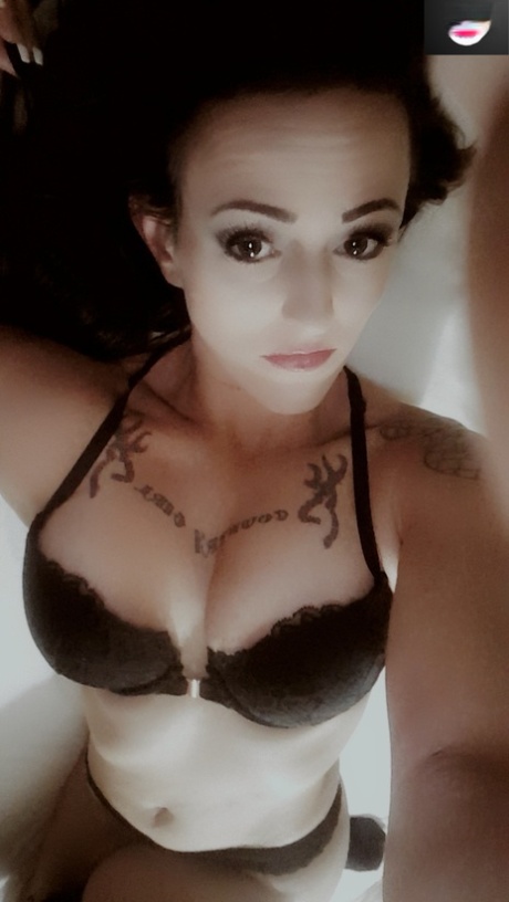 Amateur babe teases with her juicy tits while taking selfies in black lingerie