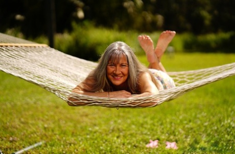 Hot mature woman in a flowered dress Leilani Lei masturbates on a hammock Dress pictures & video #11