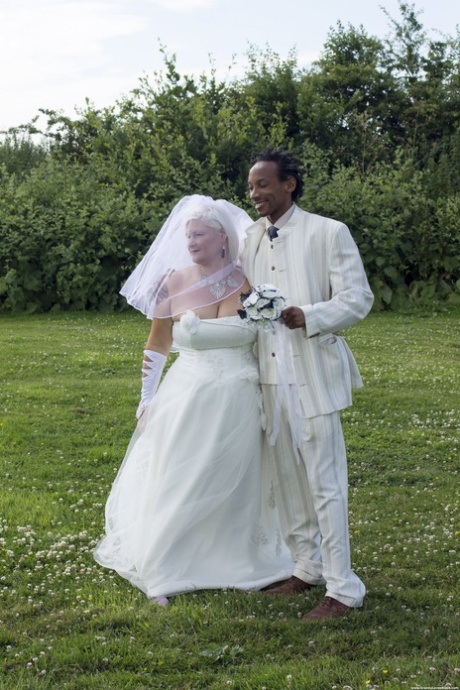 Blonde: Mature bride Lacey Starr blows off her black groom after the ceremony.