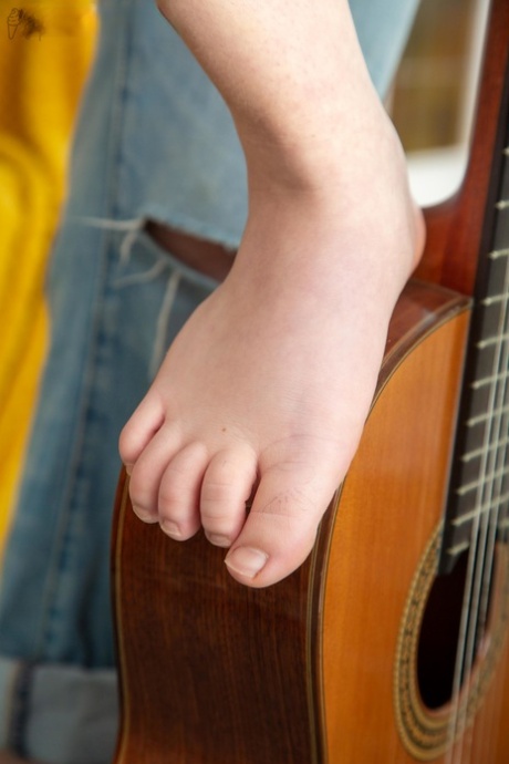 Catching up: Guitarist Catalina A demonstrating how to play her deliciously anus while holding her pussy subject up close.