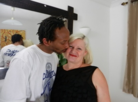 Horny granny Lacey Starr seduces a slim black stud and performs an orgasm with his massive rod.