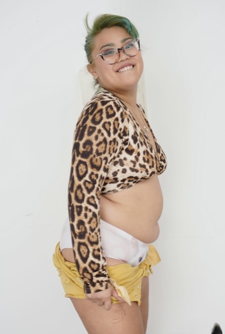 Solo photo: Chubby Asian female Manila Bey flaunts her fat body while posing without clothes.