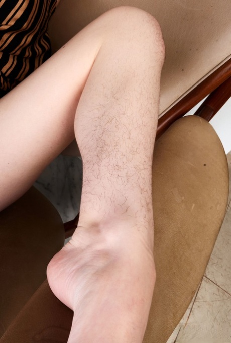 A young girl named Rosalyn Sphinx displays her unshaved legs and hairy blemishes.