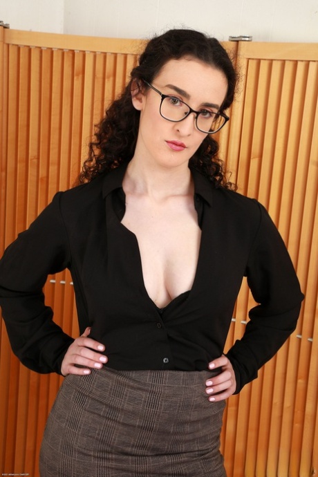 Sexy and nerdy Lyra Lockhart displays her big tits and long hair in public.