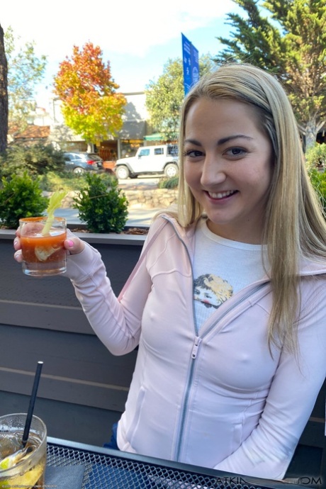 Lily Adams, a charming young woman, flaunting her shaved body with a tampon.