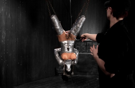 The sub, Beretta James, gets taped down and covered in BDSM suspension.