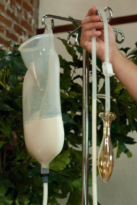Curvaceous Beverly Hills Taking A Messy Milk Enema In A Kinky BDSM Scene