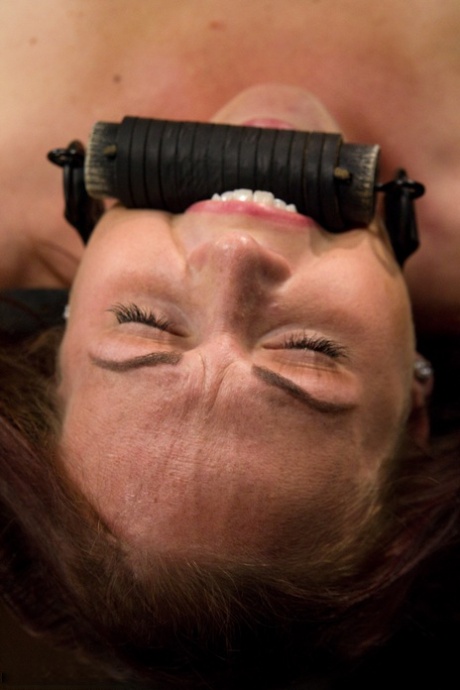 Redhead MILF Josi is subjected to a tight but necessary amount of fisting in stock and pillory BDSM.