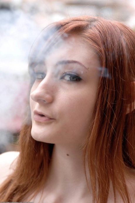 Redheaded Smoker Violet Monroe Flaunts Her Big Ass In An Outdoor Striptease