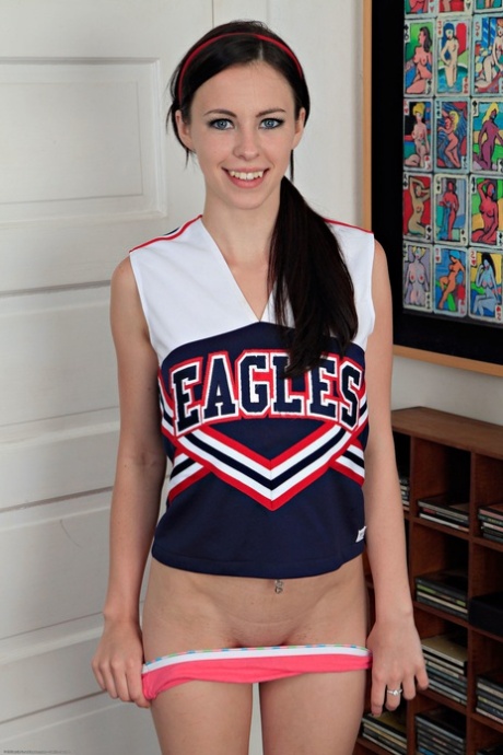 American cheerleader Veronica Radke releases her clothes and slowly massages her endearing pussy.