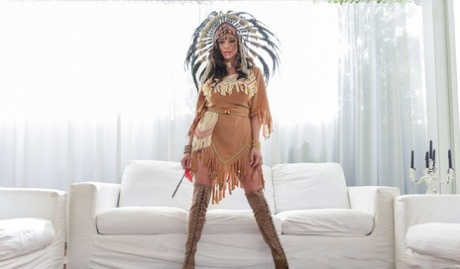 Big boobs: Ariella Ferrera, a Native Indian native, is spooned on the sofa.