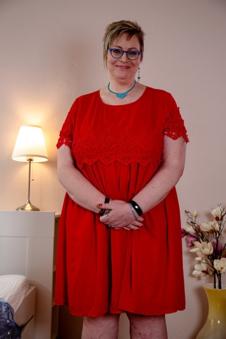 Old Fatty In Glasses Denisa Removes Her Red Dress & Lets Out Her Massive Juggs