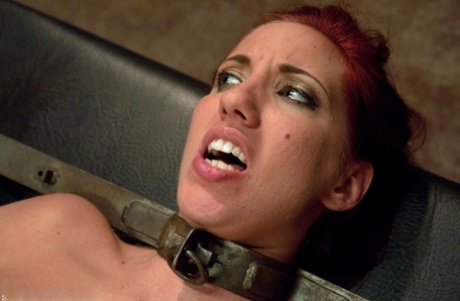 Sexy redhead Kelly Divine receives oral sex from celebrity chef Audrey Rose while tied up in a tie.