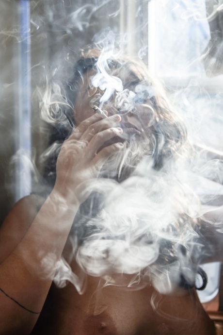 Silver, an amateur smokes a spliff and is captured on camera smoking both inside and outside while in the nude.