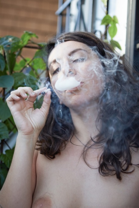 Using only her hands as props, Nikki Silver is an amateur smoke enthusiast who poses for photos in the nude.