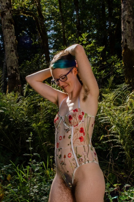 The forest is where Minerva Fury, a tall hippie with eyeglasses and petite figure, displays her hairy body in the background.