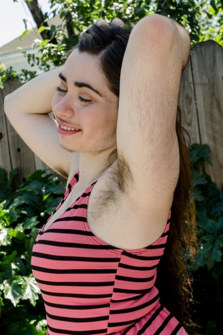 Kisa Fae, an amateur with a mustache, exposes her hairy armpits and pulls out her beard.