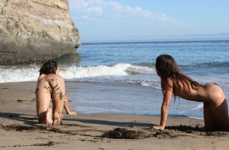 On the beach, amateur models with big bellies and drooping pussies practicing yoga in a playful manner.