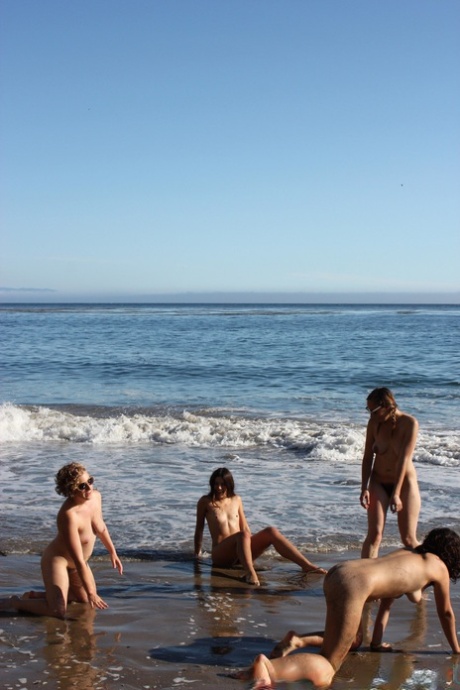 Beach volleyball enthusiasts with big tits and hairy pussies practicing yoga poses.