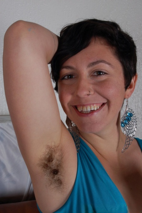 Amateur mom Nikki Silver exhibits her bushy twat and armpits in an individual fashion.