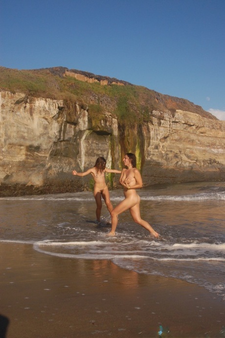 A group of amateur sex workers with hair tied in a tunic lounger and naked on the beach.