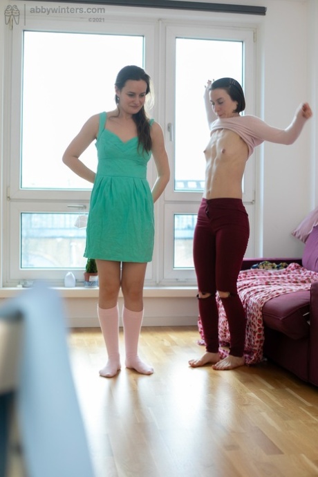 Lesbian duo Justina and Flo flaunting their hairdos and ample breasts.